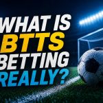 Football-themed BTTS betting graphic with a soccer ball, goal net, stadium lights, and bold text reading “What is BTTS betting really?”